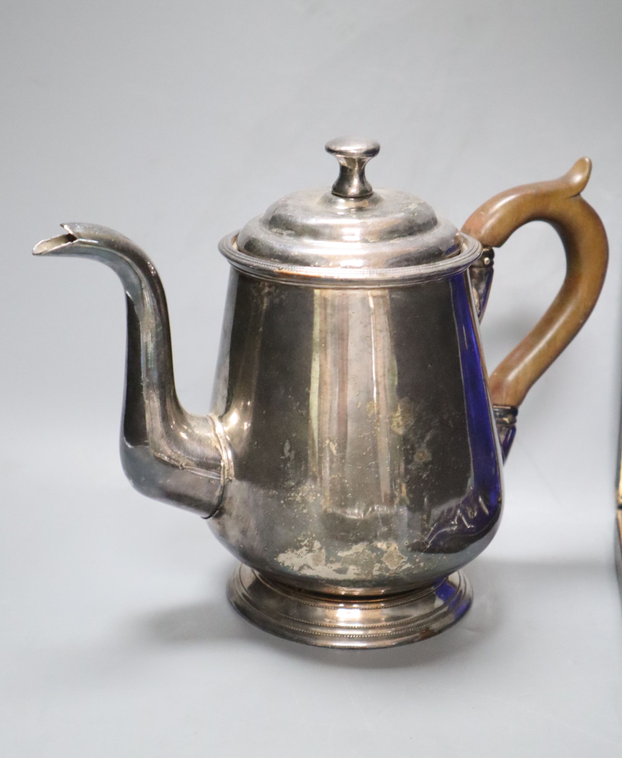 An Eastern embossed plated tray, a cased plated nut and grape set, a plated coffee pot, a silver sauce ladle and sundries
